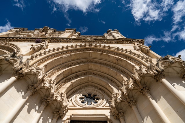 Building continued over several centuries, resulting in a mix of architectural influences.