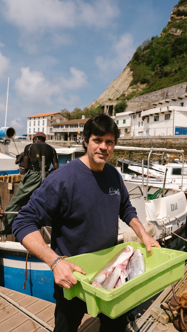 Fresh fish is picked up and ready to be grilled for the diners at Elkano in Getaria.