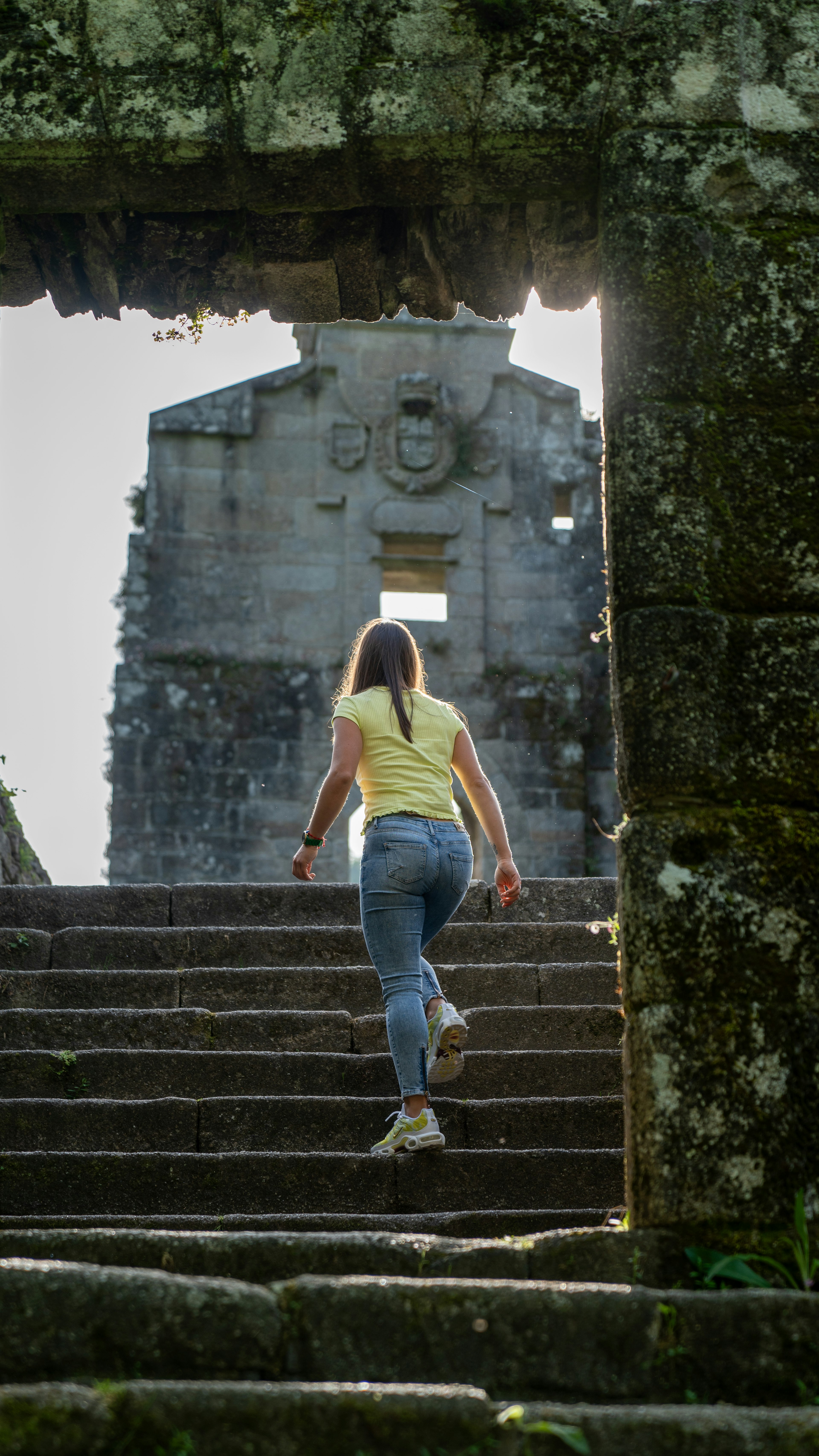 Estefanía Gonzalez leads the way through a ruin in the Fragas do Eume.