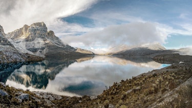 Mountains reflected in Andean lake.